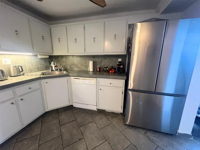 a view of a hallway with a door