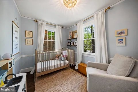 a living room with furniture and stairs