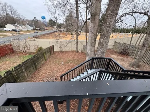 a view of balcony with wooden floor