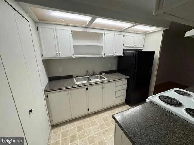 a kitchen with a sink and cabinets