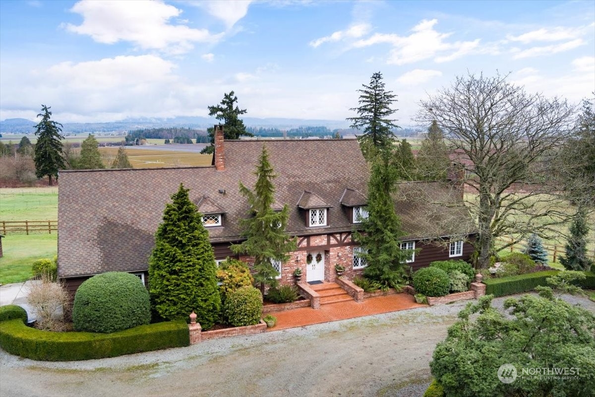 15253 Josh Wilson Road Burlington, WA 98233 - Photo 1 of 40 an aerial view of a house with garden space and street view
