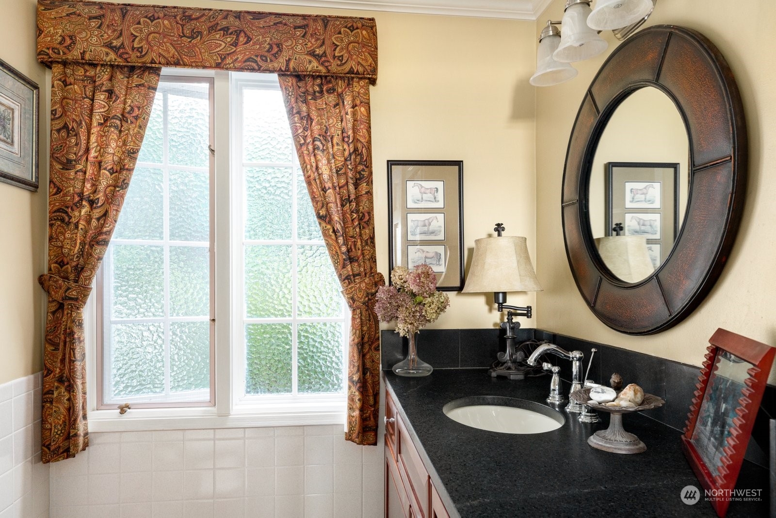 15253 Josh Wilson Road Burlington, WA 98233 - Photo 13 of 40 a bathroom with a sink a mirror and a window