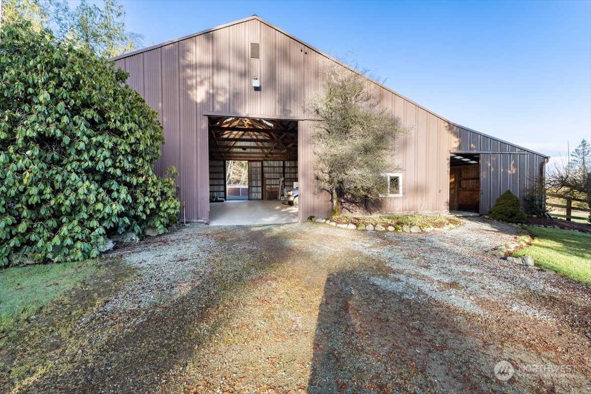 15253 Josh Wilson Road Burlington, WA 98233 - Photo 34 of 40 a view of a house with a yard