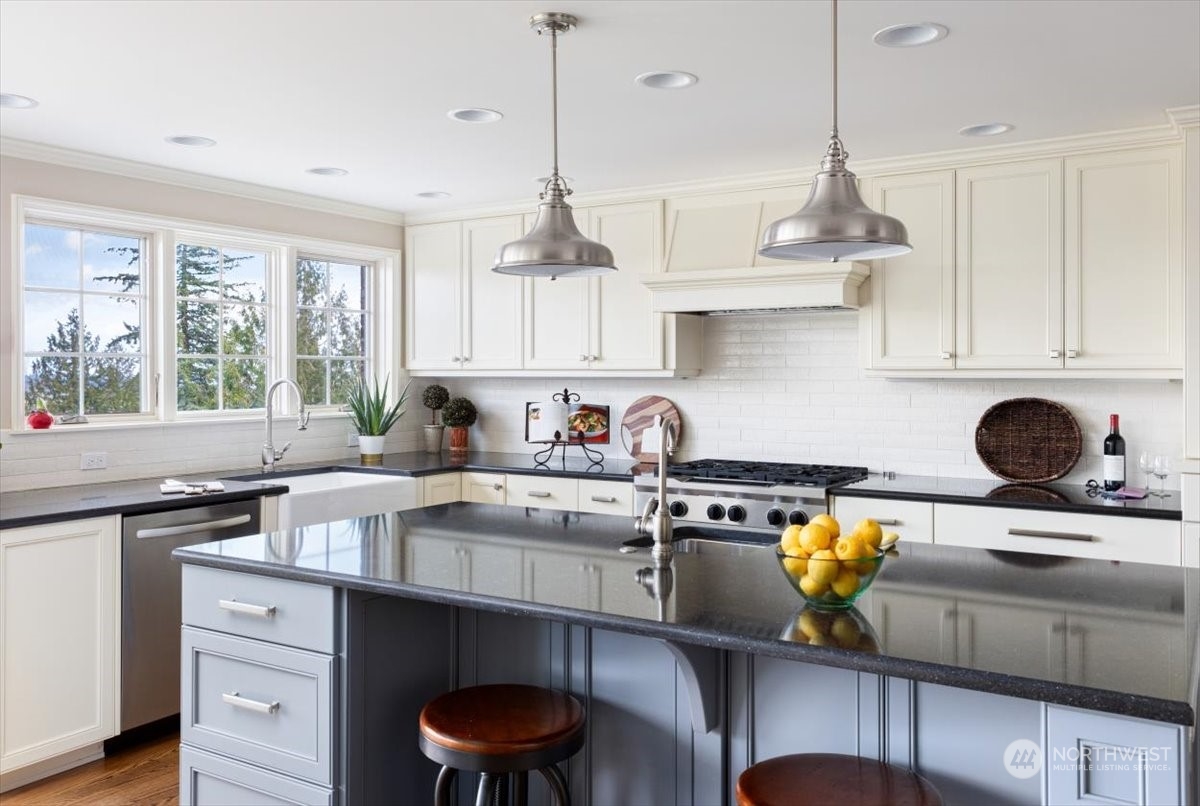 15253 Josh Wilson Road Burlington, WA 98233 - Photo 8 of 40 a kitchen with stainless steel appliances granite countertop a sink a stove and a cabinets