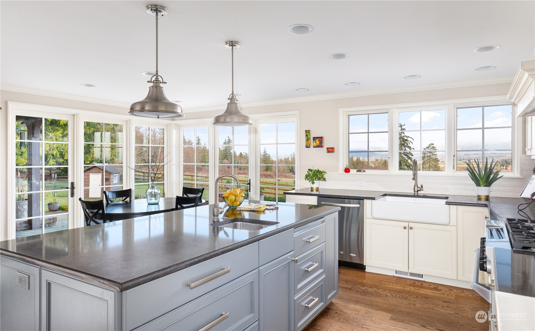15253 Josh Wilson Road Burlington, WA 98233 - Photo 10 of 40 a kitchen with stainless steel appliances granite countertop a sink a stove and a wooden floors