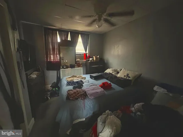 a bedroom with furniture and a window