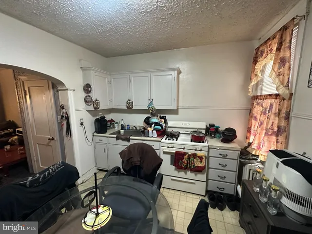 a work place with furniture and a window