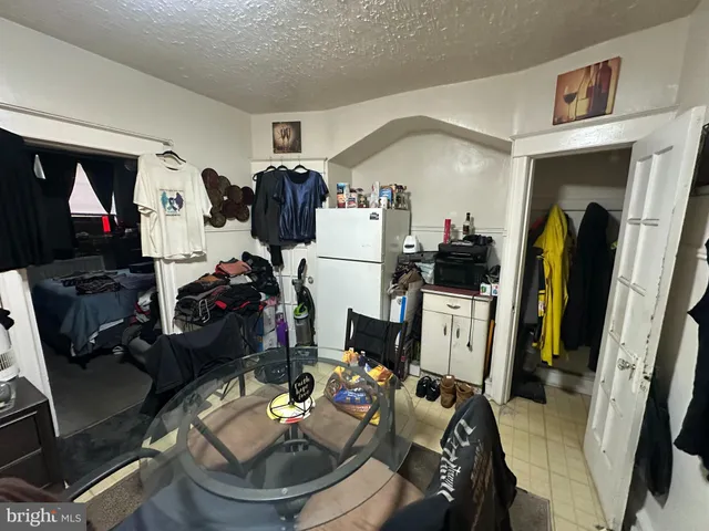 a living room with furniture and a mirror