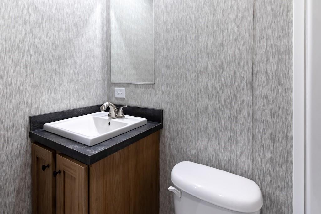 321 Beallsville Road Bentleyville, PA 15314 - Photo 19 of 22 a bathroom with a sink a toilet and a mirror