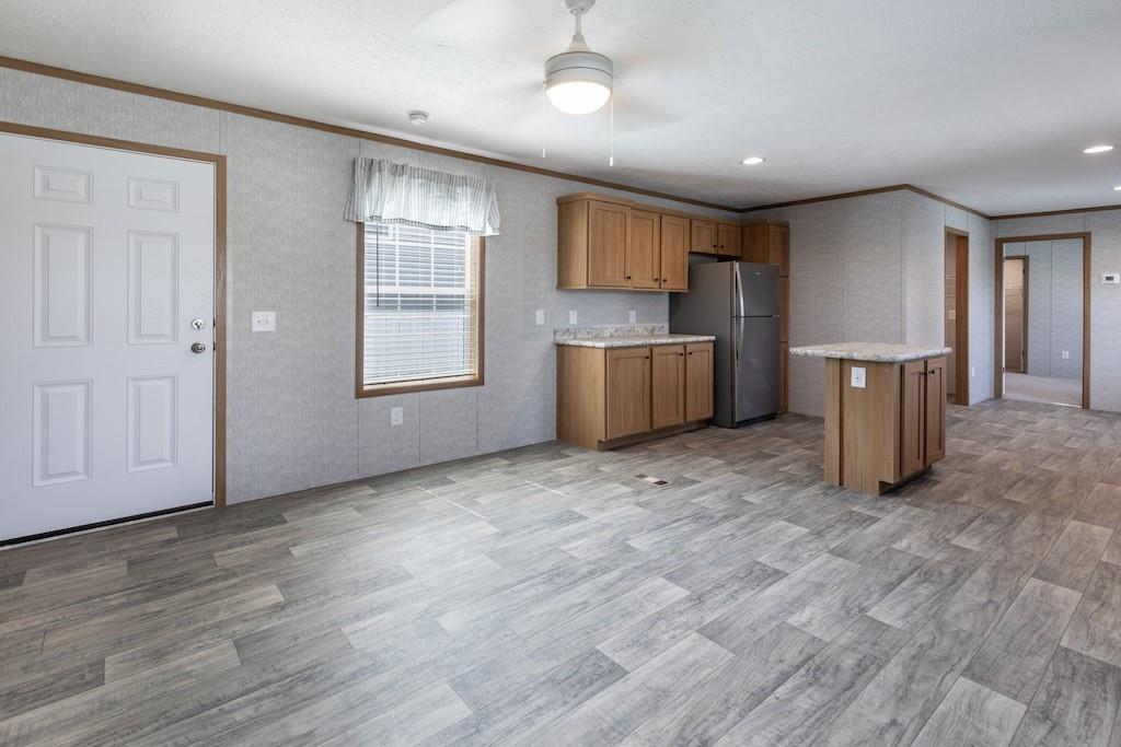321 Beallsville Road Bentleyville, PA 15314 - Photo 5 of 22 a view of an empty room with a window and wooden floor