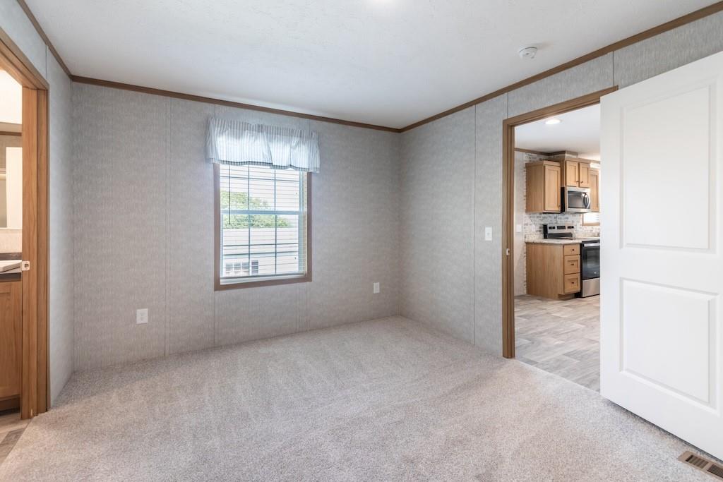 321 Beallsville Road Bentleyville, PA 15314 - Photo 10 of 22 a view of a kitchen with a sink cabinet and a window