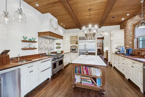 a large kitchen with lots of counter space and window