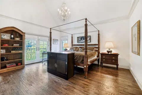 a bedroom with furniture and a window