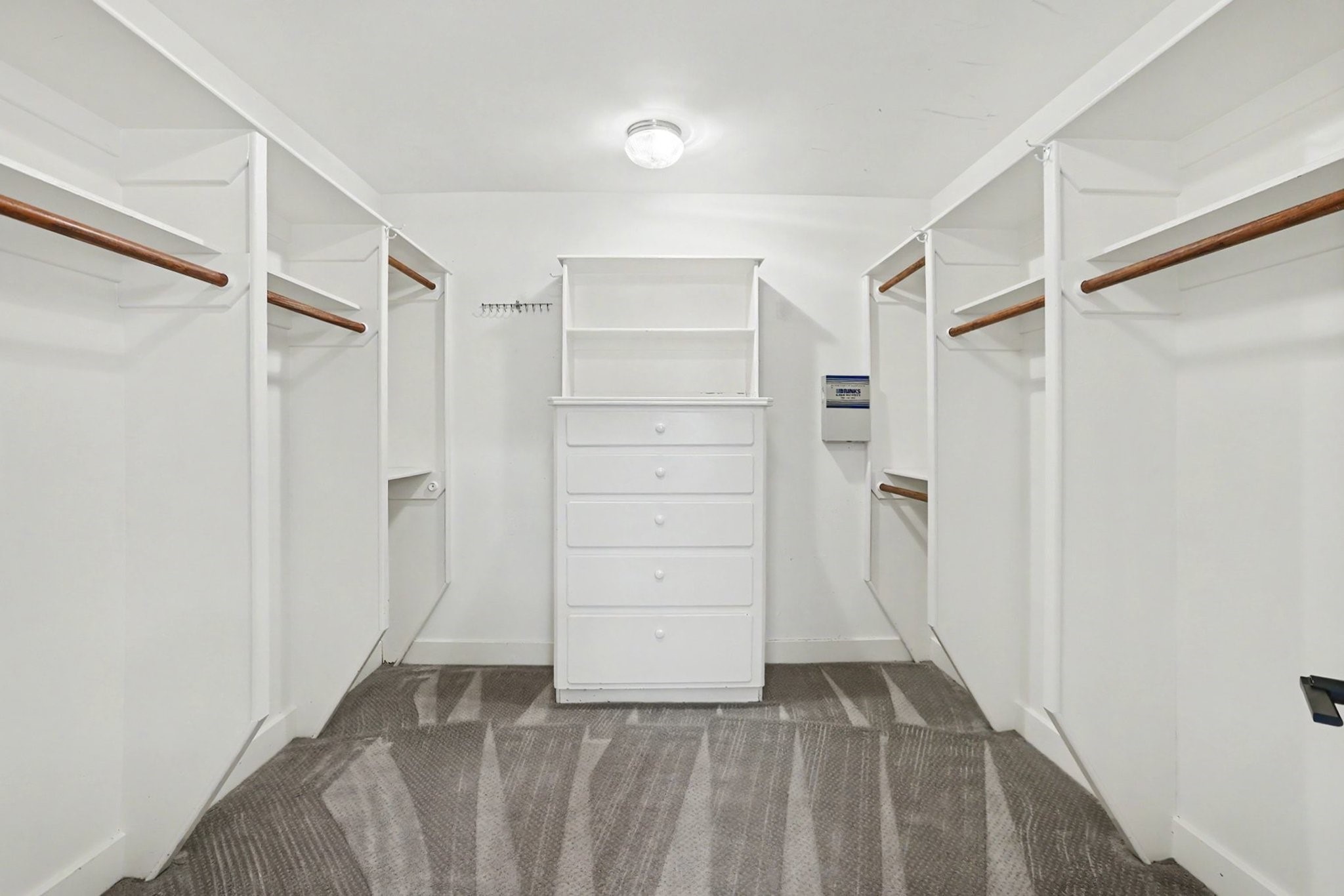 1470 Springrock Lane, Unit 6 Houston, TX 77055 - Photo 19 of 31 Generous walk-in closet with built-in cabinetry, offering plenty of storage and organization.