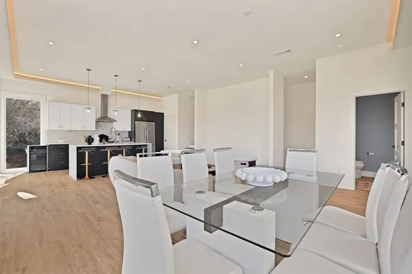 a living room with stainless steel appliances kitchen island granite countertop furniture and a kitchen view