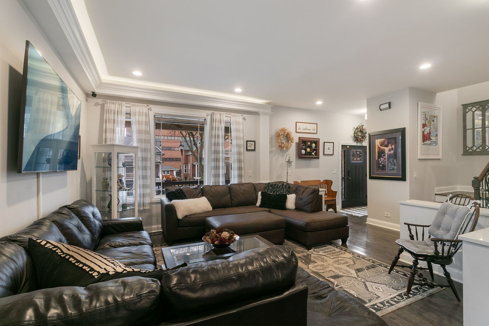3239 Wesley Avenue Berwyn, IL 60402 - Photo 3 of 10 a living room with furniture and a flat screen tv