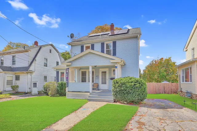 a front view of a house with a yard