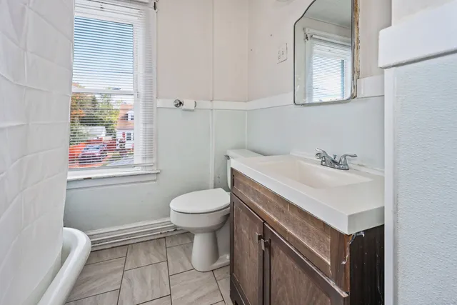 a bathroom with a sink toilet and vanity