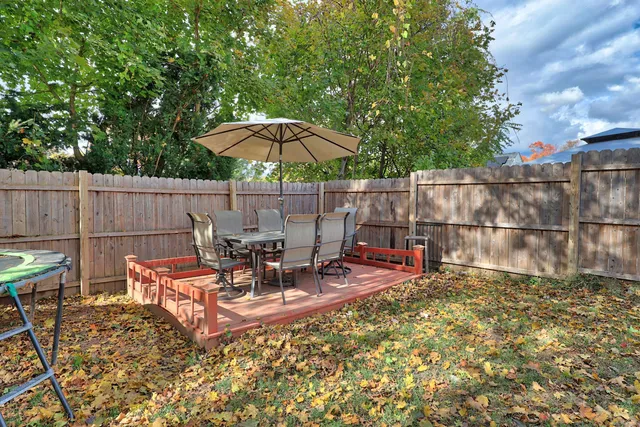 a view of a backyard with sitting area and furniture