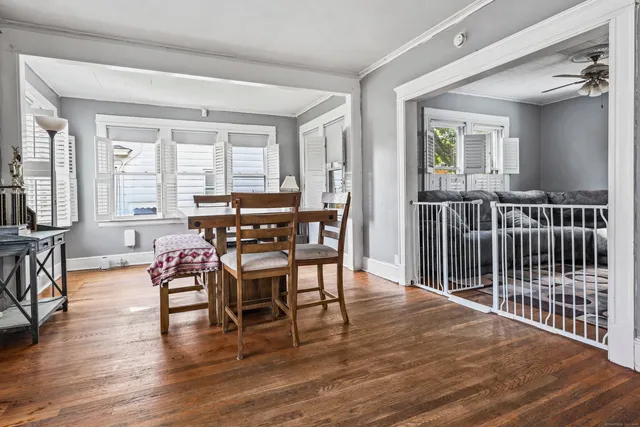 a view of a dining room with furniture window and wooden floor