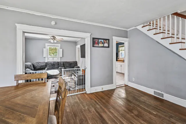 a view of a livingroom with furniture and hardwood floor