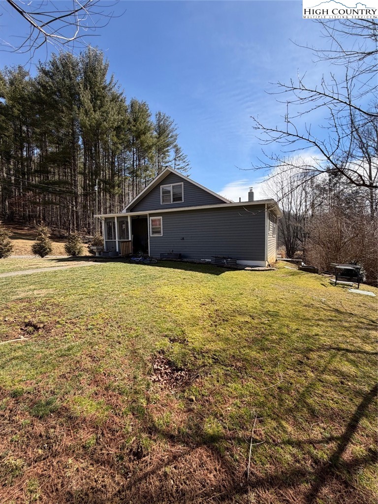 733 Clark Swift Road Vilas, NC 28692 - Photo 2 of 36 a view of a house with a yard