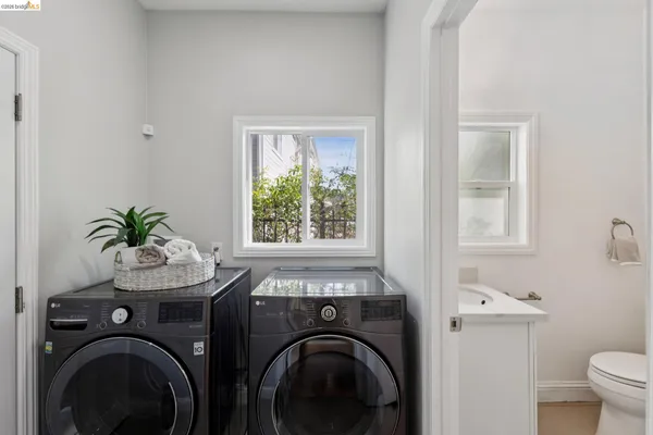 a view of a storage and utility room with washer and dryer