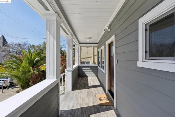 a view of balcony and car parked