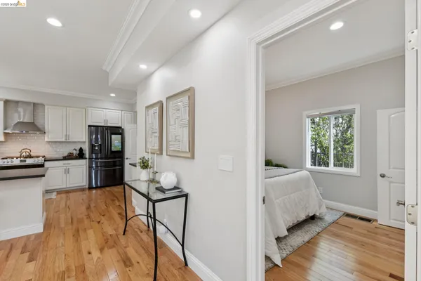 a bedroom with furniture and a wooden floor