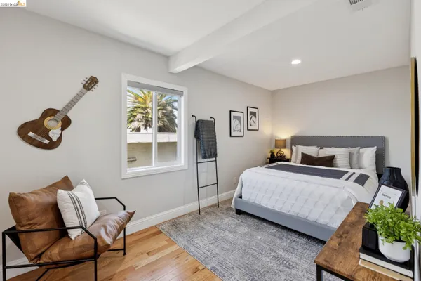 a bedroom with bed and window