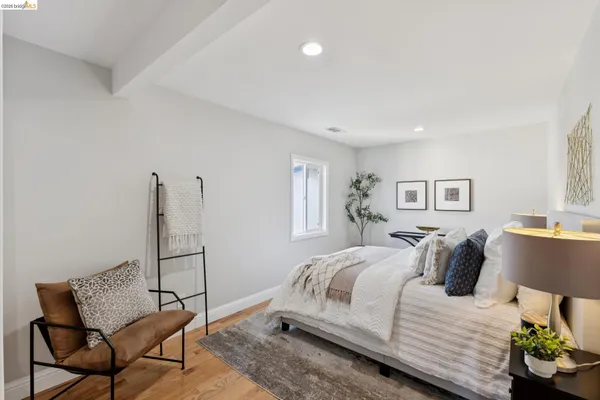 a bedroom with a bed and a couch