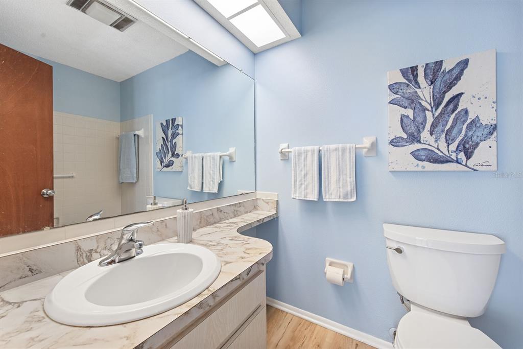 9 Quails Run Boulevard, Unit 9 Englewood, FL 34223 - Photo 19 of 42 a bathroom with a sink and a toilet