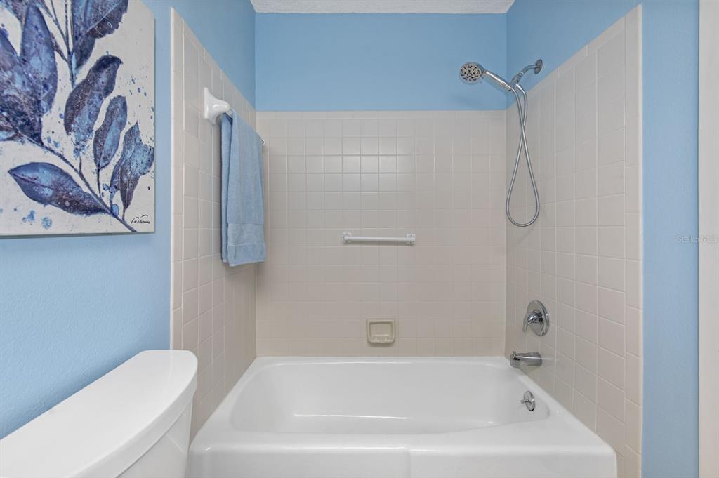9 Quails Run Boulevard, Unit 9 Englewood, FL 34223 - Photo 20 of 42 a bathroom with a bathtub and shower