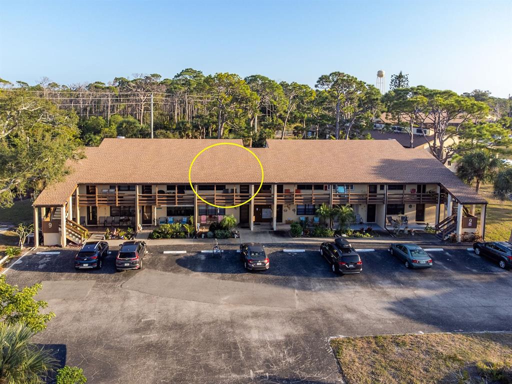 9 Quails Run Boulevard, Unit 9 Englewood, FL 34223 - Photo 2 of 42 a view of multiple houses with a city view