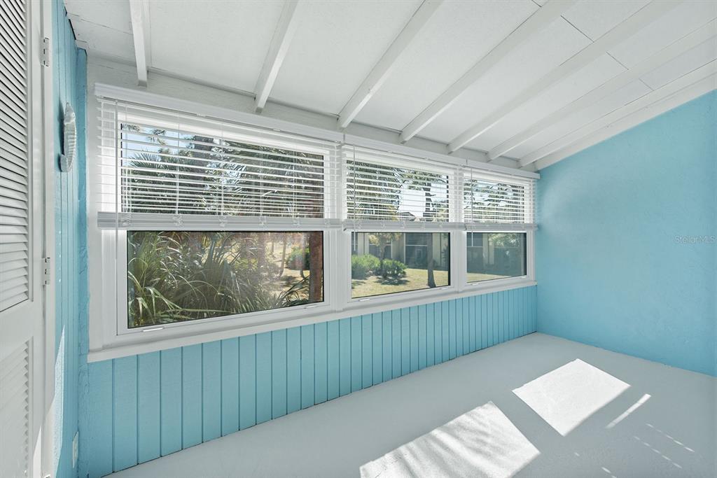 9 Quails Run Boulevard, Unit 9 Englewood, FL 34223 - Photo 23 of 42 a view of a room that has a bed in it