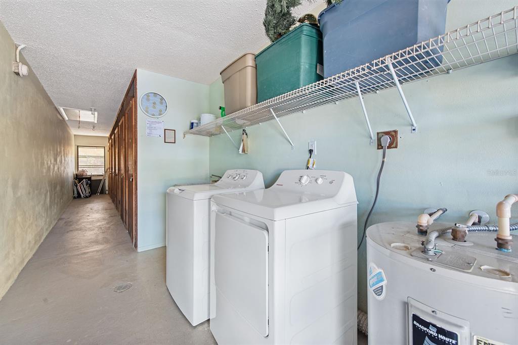 9 Quails Run Boulevard, Unit 9 Englewood, FL 34223 - Photo 27 of 42 a utility room with dryer and washer