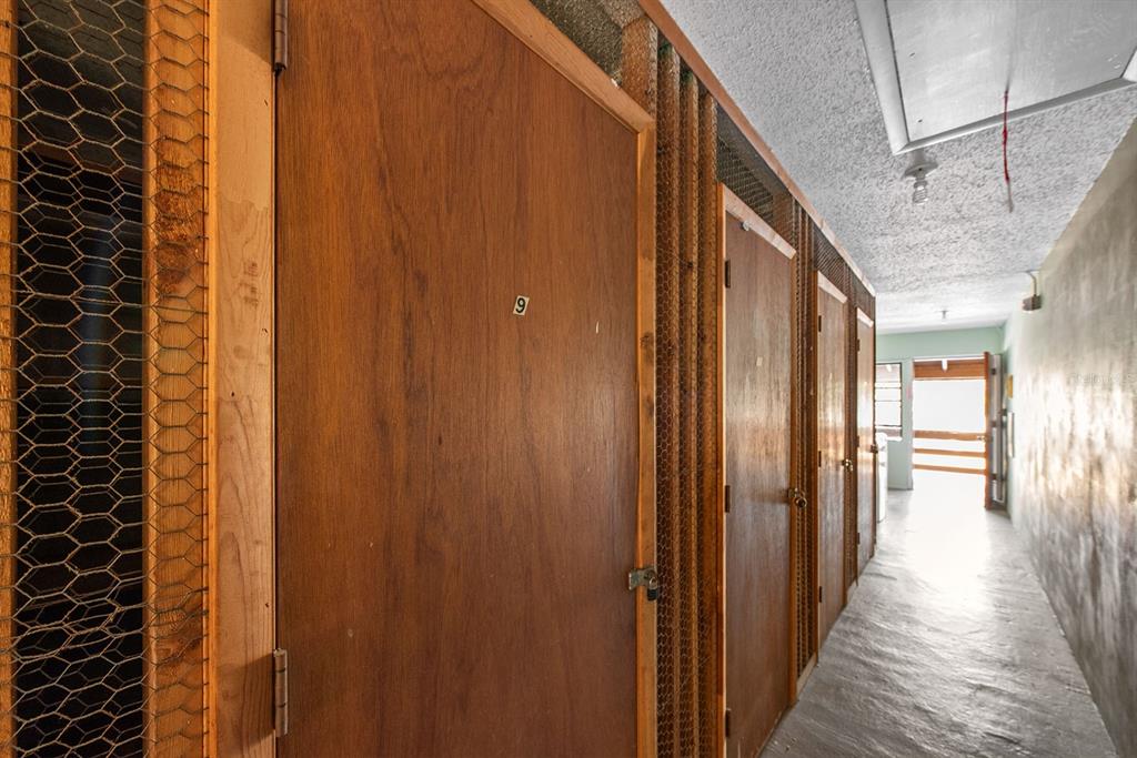 9 Quails Run Boulevard, Unit 9 Englewood, FL 34223 - Photo 28 of 42 a view of a hallway with wooden floor and staircase