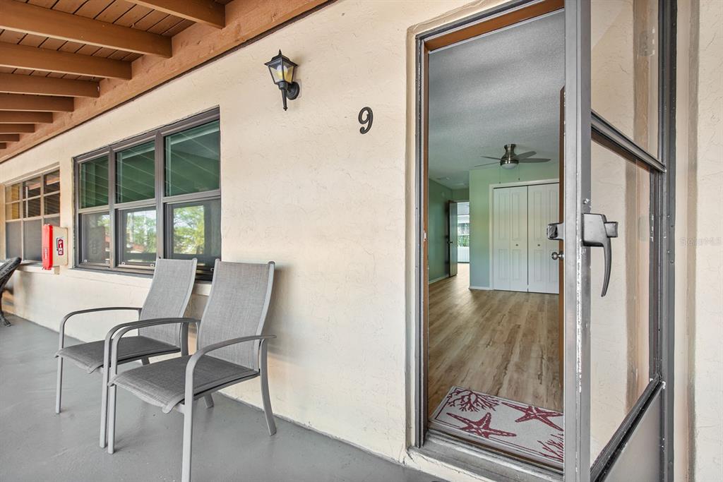 9 Quails Run Boulevard, Unit 9 Englewood, FL 34223 - Photo 3 of 42 a view of a hallway with furniture and front door