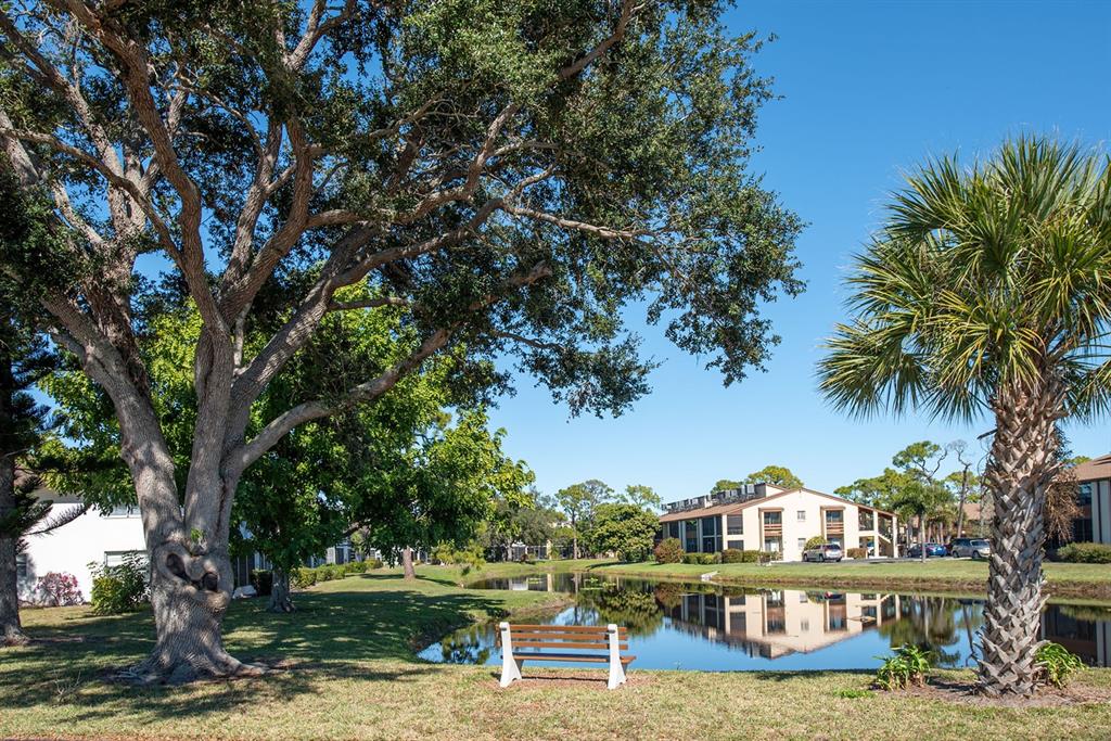 9 Quails Run Boulevard, Unit 9 Englewood, FL 34223 - Photo 35 of 42 a view of house with outdoor space and swimming pool