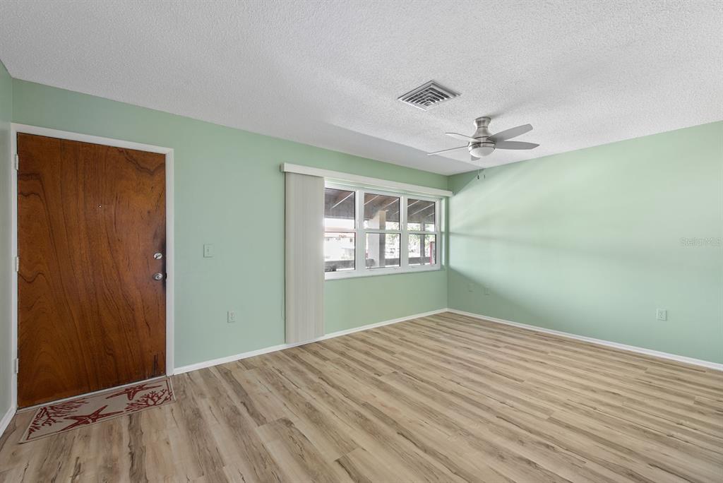 9 Quails Run Boulevard, Unit 9 Englewood, FL 34223 - Photo 6 of 42 a bedroom with a bed and a window