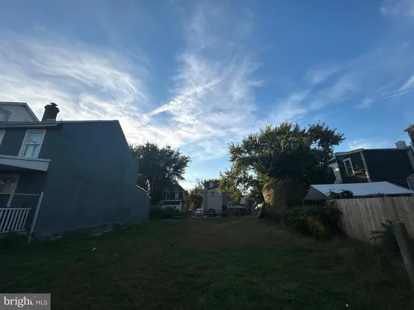 a view of backyard with seating space