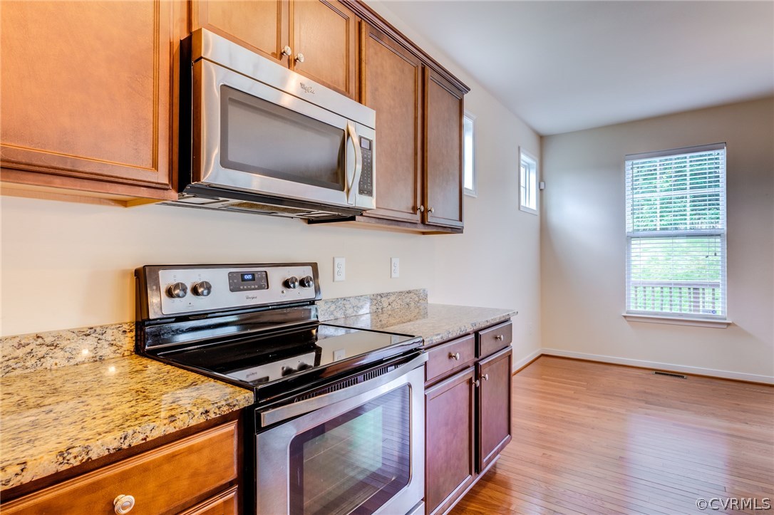 14513 Needham Market Road Midlothian, VA 23112 - Photo 12 of 31 a kitchen with a stove and a microwave