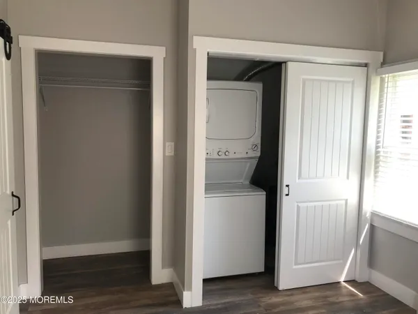 a view of hallway with wooden floor