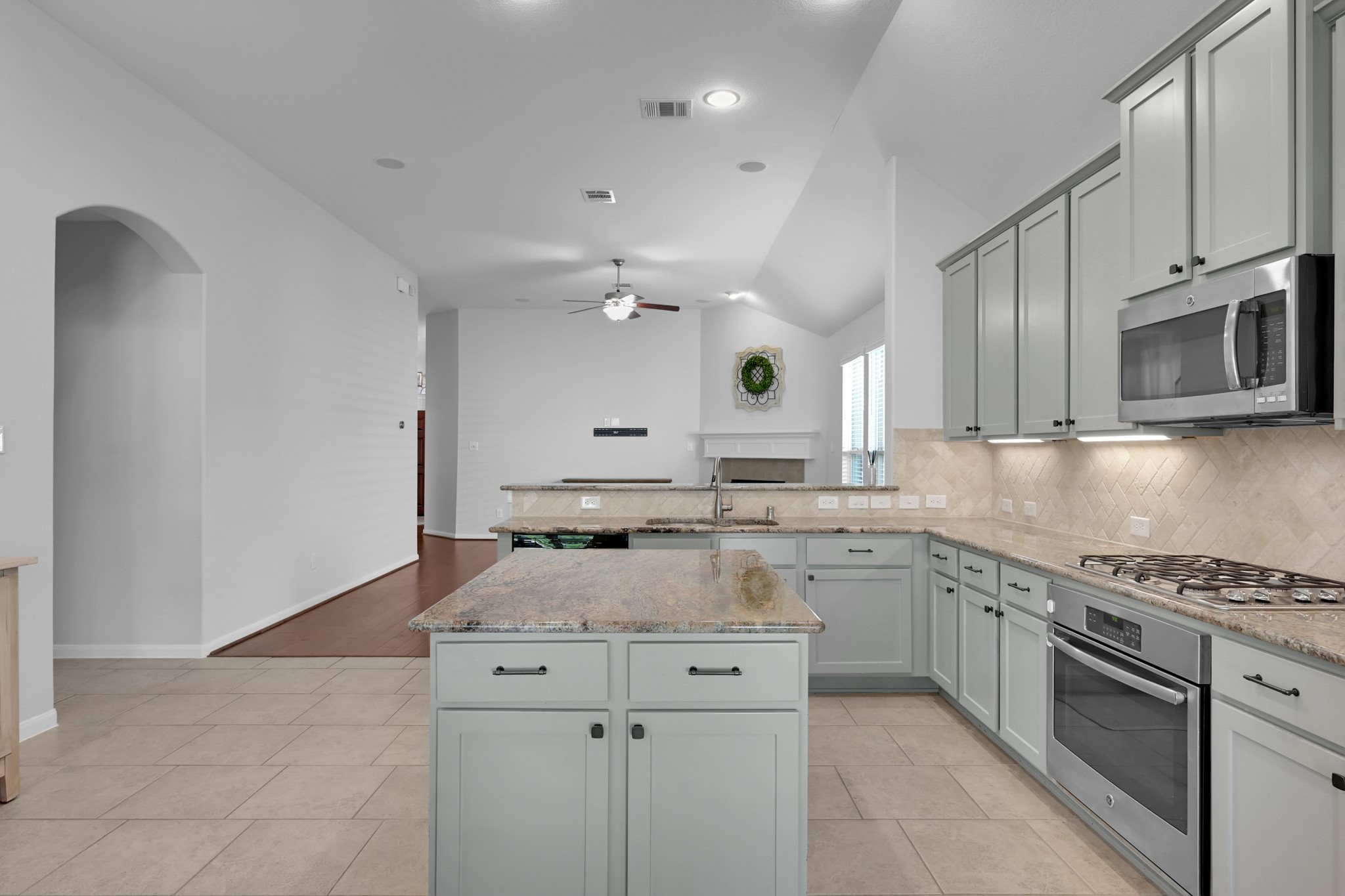 31851 Chapel Rock Lane Spring, TX 77386 - Photo 12 of 50 a kitchen with a sink stove and microwave