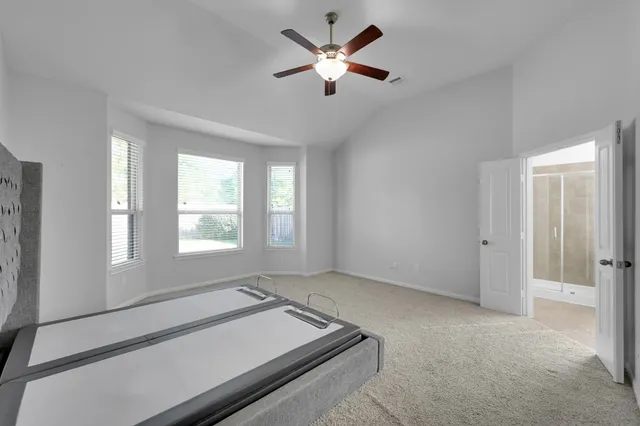a room with furniture and a ceiling fan