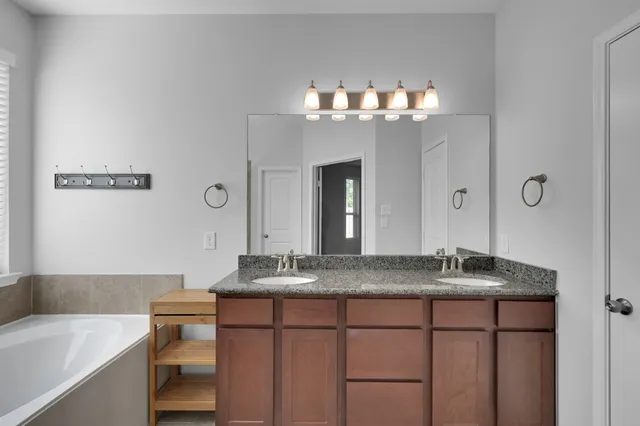 a bathroom with a bathtub and shower