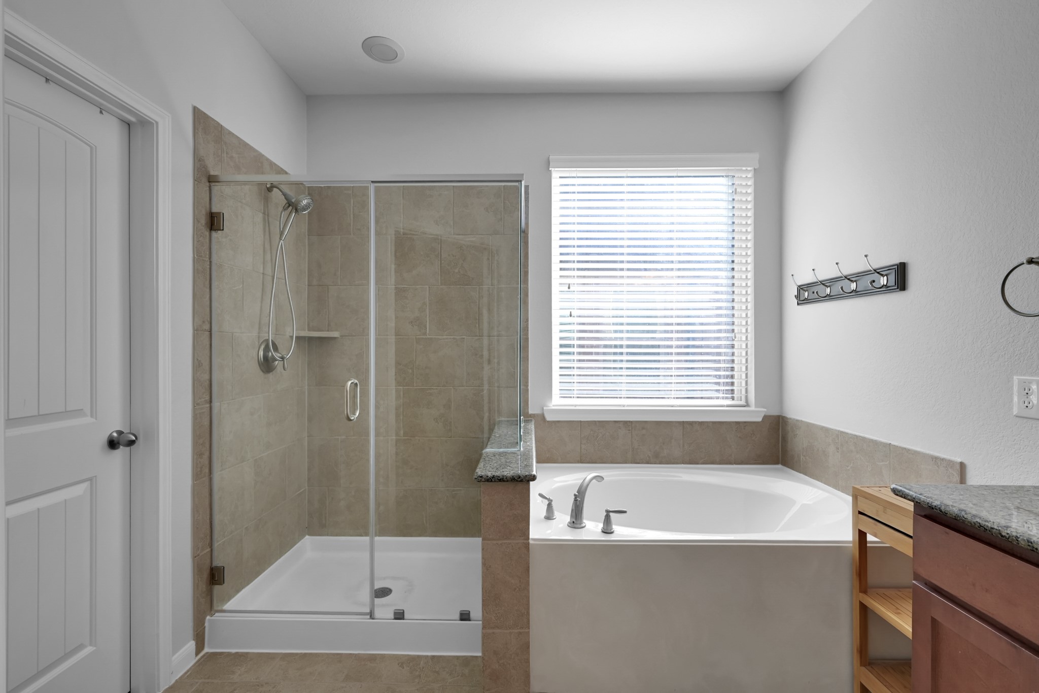 31851 Chapel Rock Lane Spring, TX 77386 - Photo 22 of 50 a bathroom with a bathtub and shower