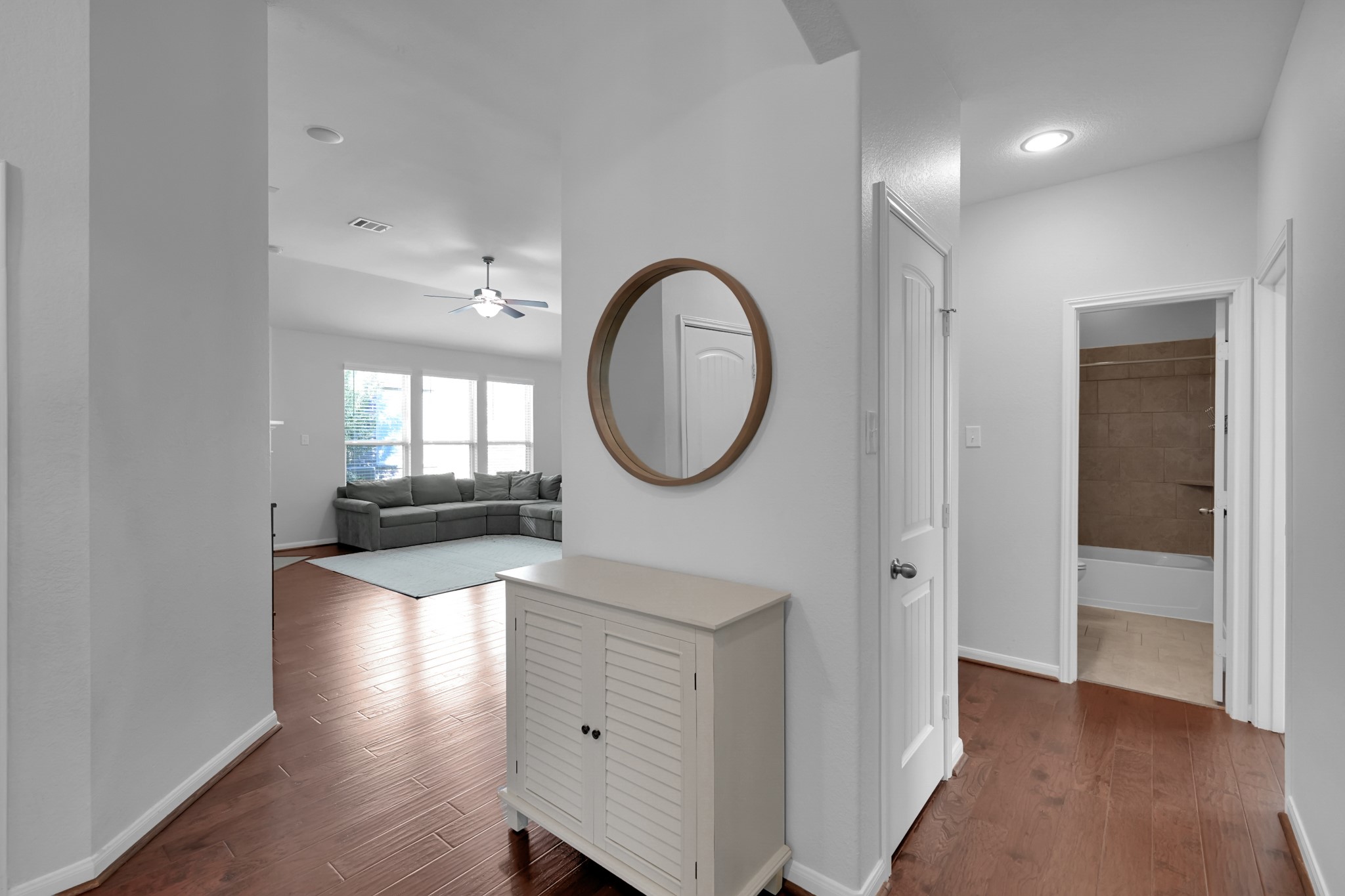31851 Chapel Rock Lane Spring, TX 77386 - Photo 30 of 50 a view of a hallway with wooden floor windows and a mirror