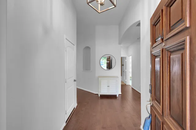 a view of an entryway and wooden floor
