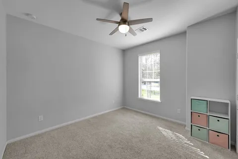 a view of an empty room with a window